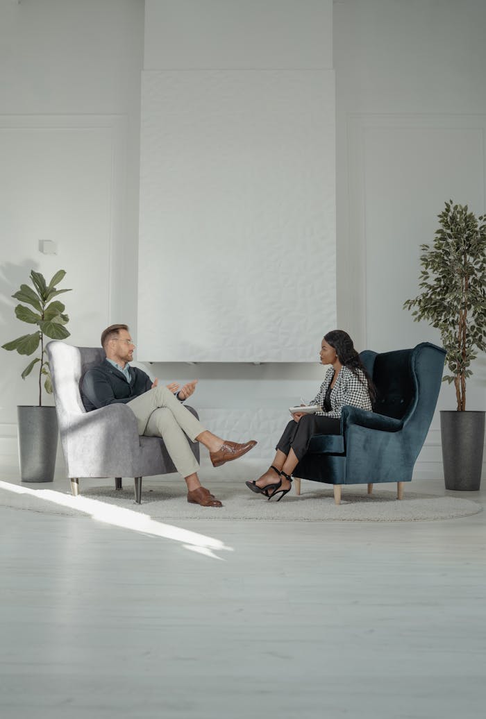 A Woman Interviewing a Man